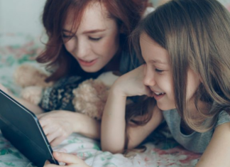 Image: A mom reading with her tween
