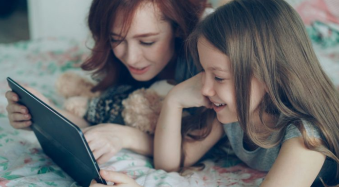 Family Reading: 3 Reasons to Read With Your Tween Image: A mom reading with her tween
