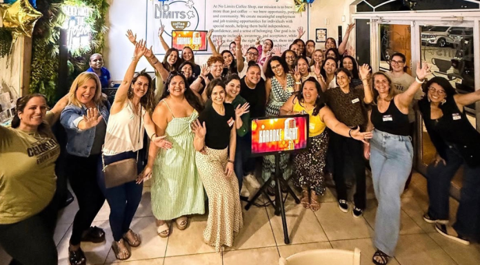 The Power of Community for Special Needs Parents Image: A group of special needs moms are gathered around a karaoke screen for a fun night out.