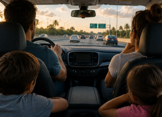 Family Vacations: Are We There Yet? Man, woman, boy and girl in a car on the highway