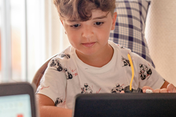 Little boy in front of a tablet