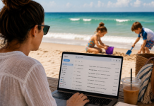 The Great Summer Guilt Trip Woman in front of computer with two kids playing in the beach