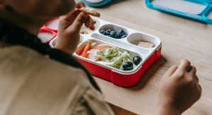 Image: A student eating from a lunchbox at school