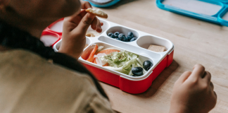 Image: A student eating from a lunchbox at school