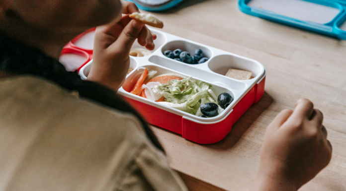 Image: A student eating from a lunchbox at school