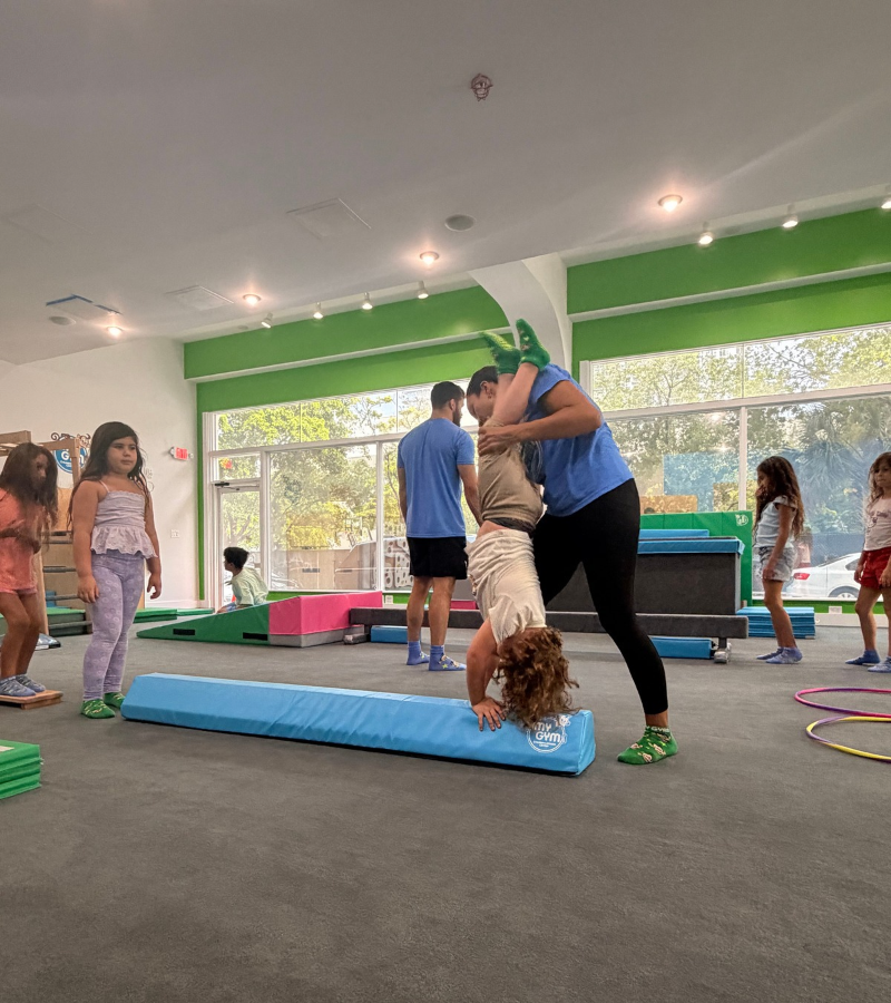 Kid doing a handstand at My Gym Edgewater.