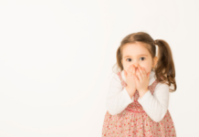 The Things Kids Say and the Stories We Tell Ourselves Little girl with her hands over her mouth